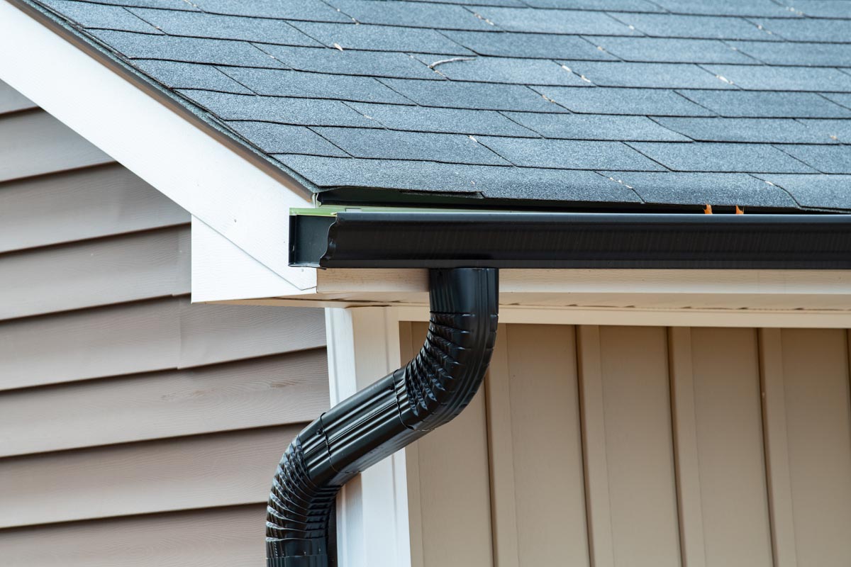 rain gutter of roof with downpipe New Roof